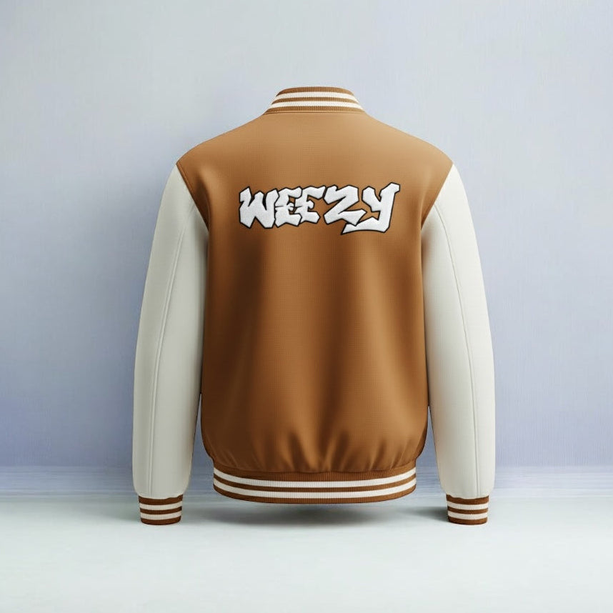 Brown and beige varsity jacket with 'WEEZY' text on the back against a grey background